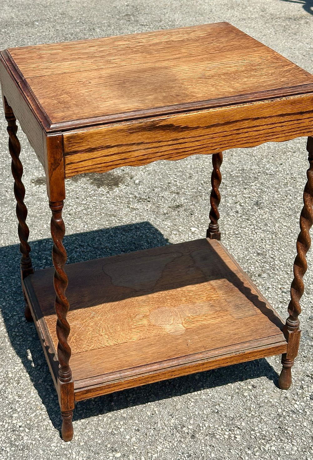 Lot 237: An early 20th-century Jacobean Revival oak two-tier side table