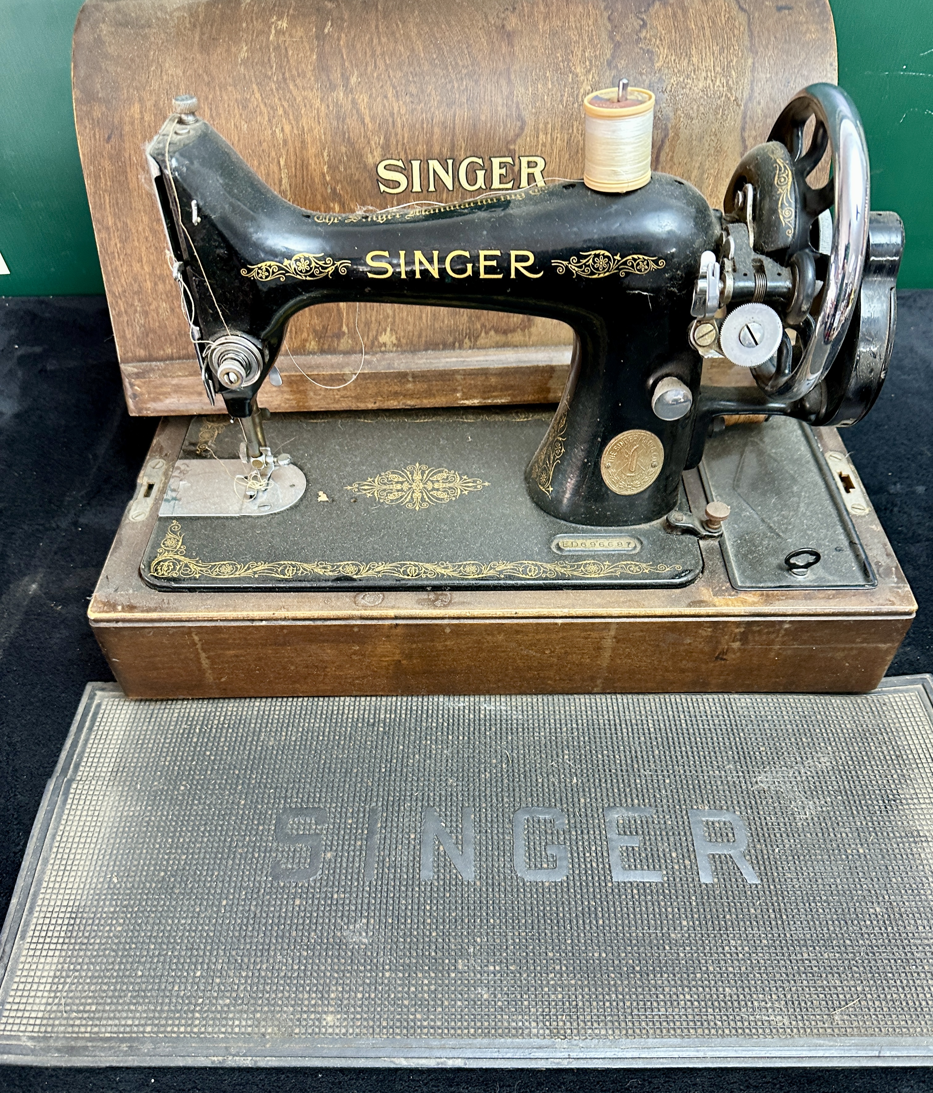 A Singer Model 99 Portable Sewing Machine with Bentwood Case and Rubber Mat