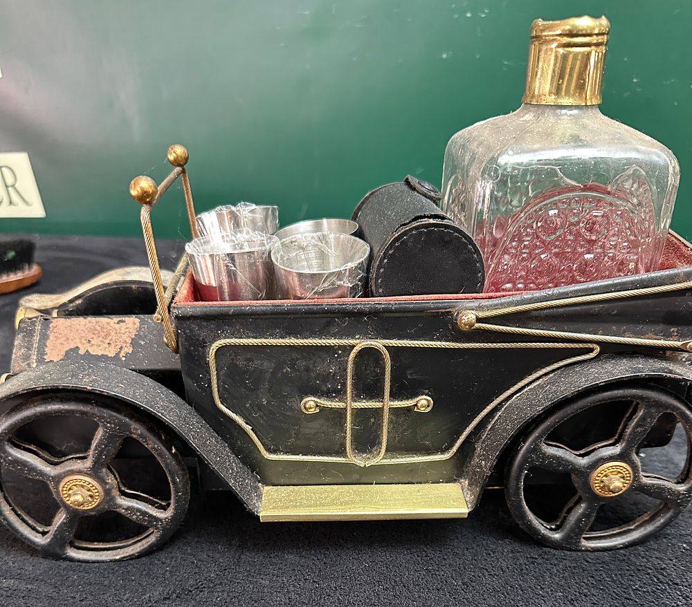 Lot 324: Vintage Novelty Metal Motor Car Decanter Bar Set and Music Box