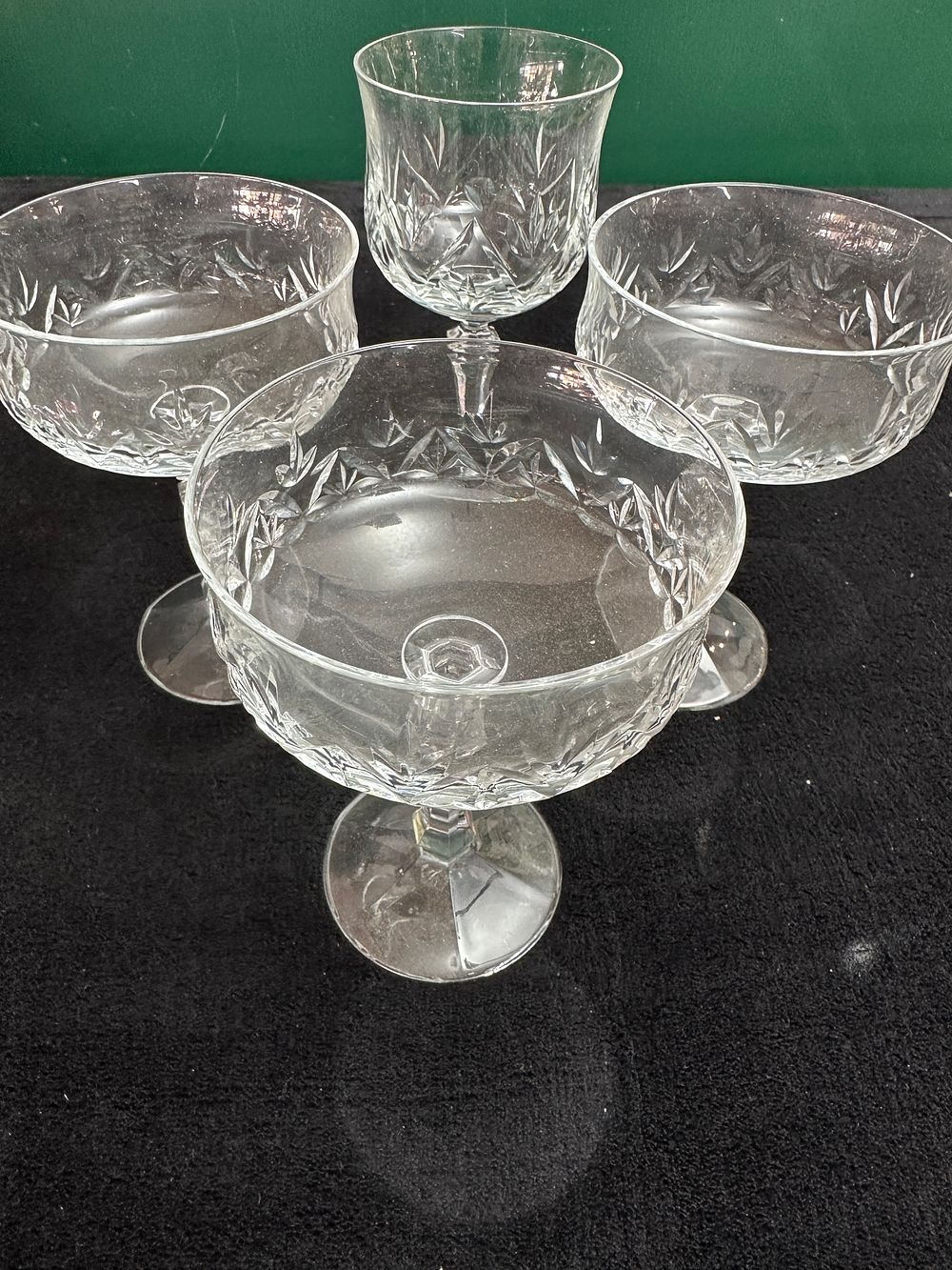 Lot 326: A Set of Four Cut Crystal Stemmed Glasses with Hexagonal Stems