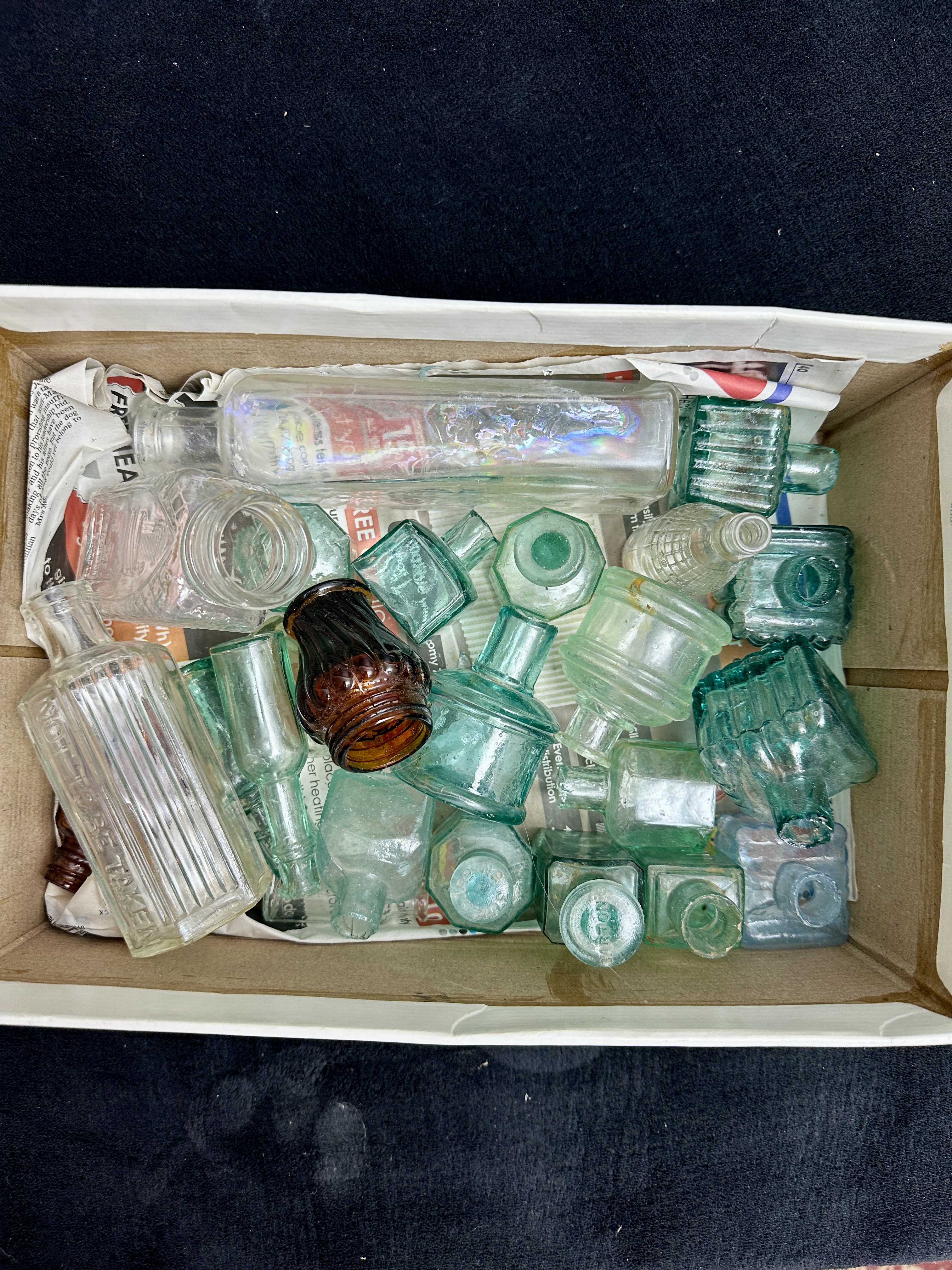 A Collection of Victorian and Edwardian Glass Bottles including Inkwells and Poison Bottles