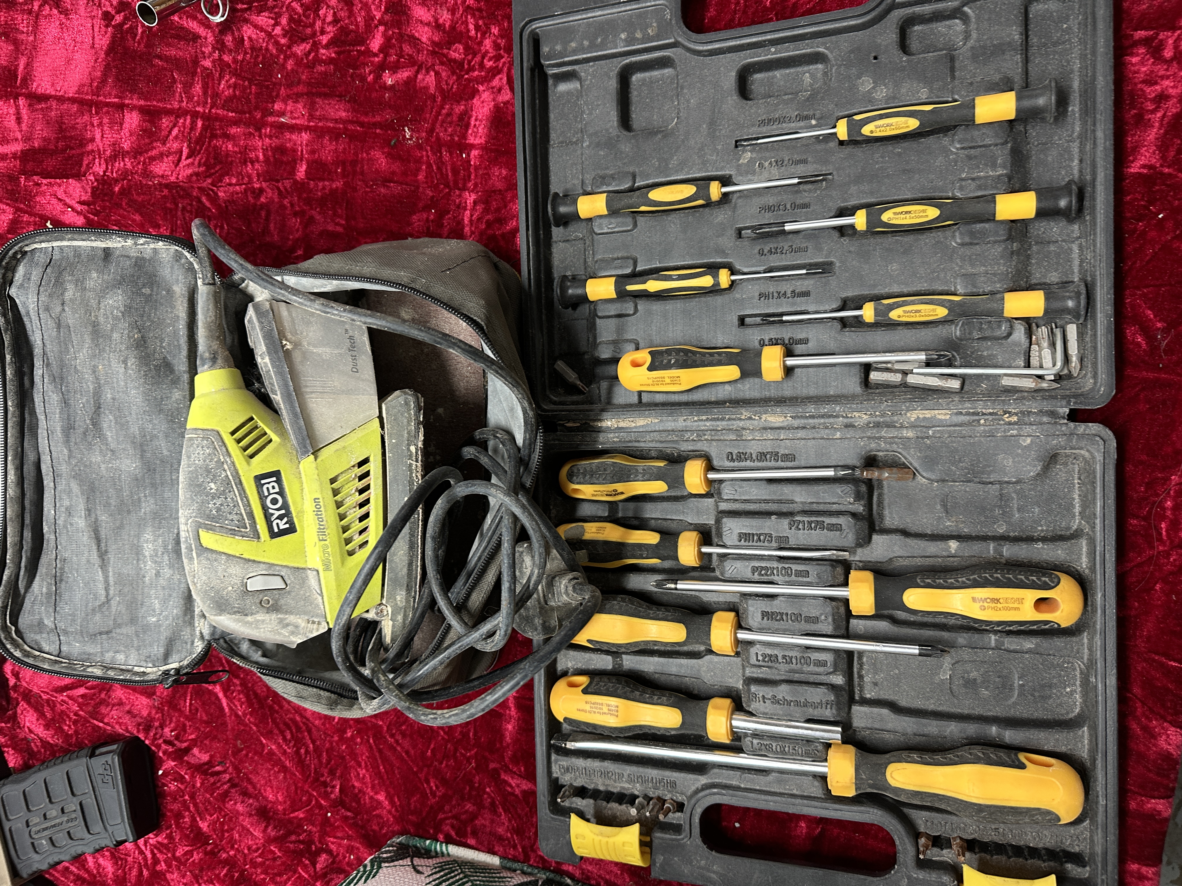 A Trio of Tools and Accessories Including Ryobi Sander, Workzone Screwdriver Set, and Magazine