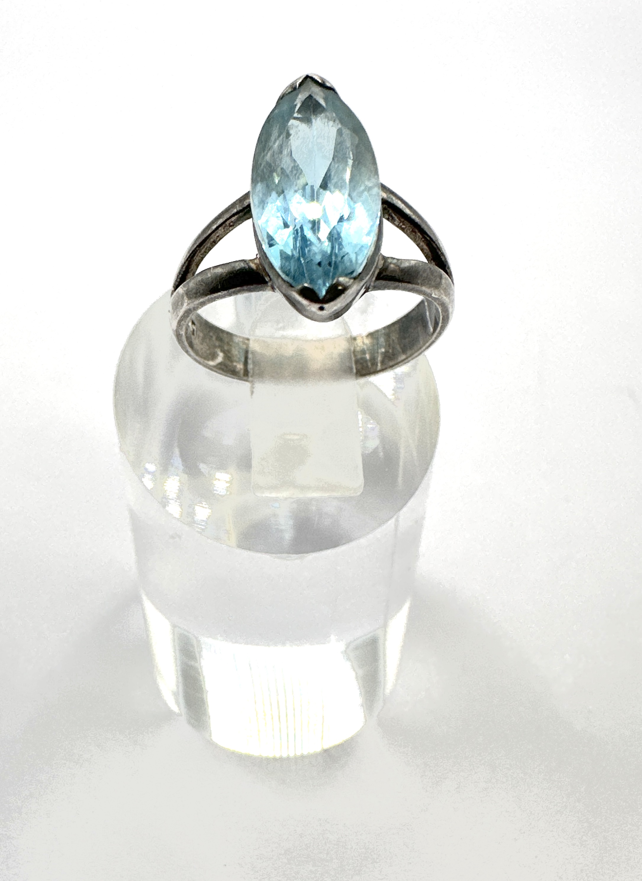 A 925 silver and marquise-cut light blue gemstone ring