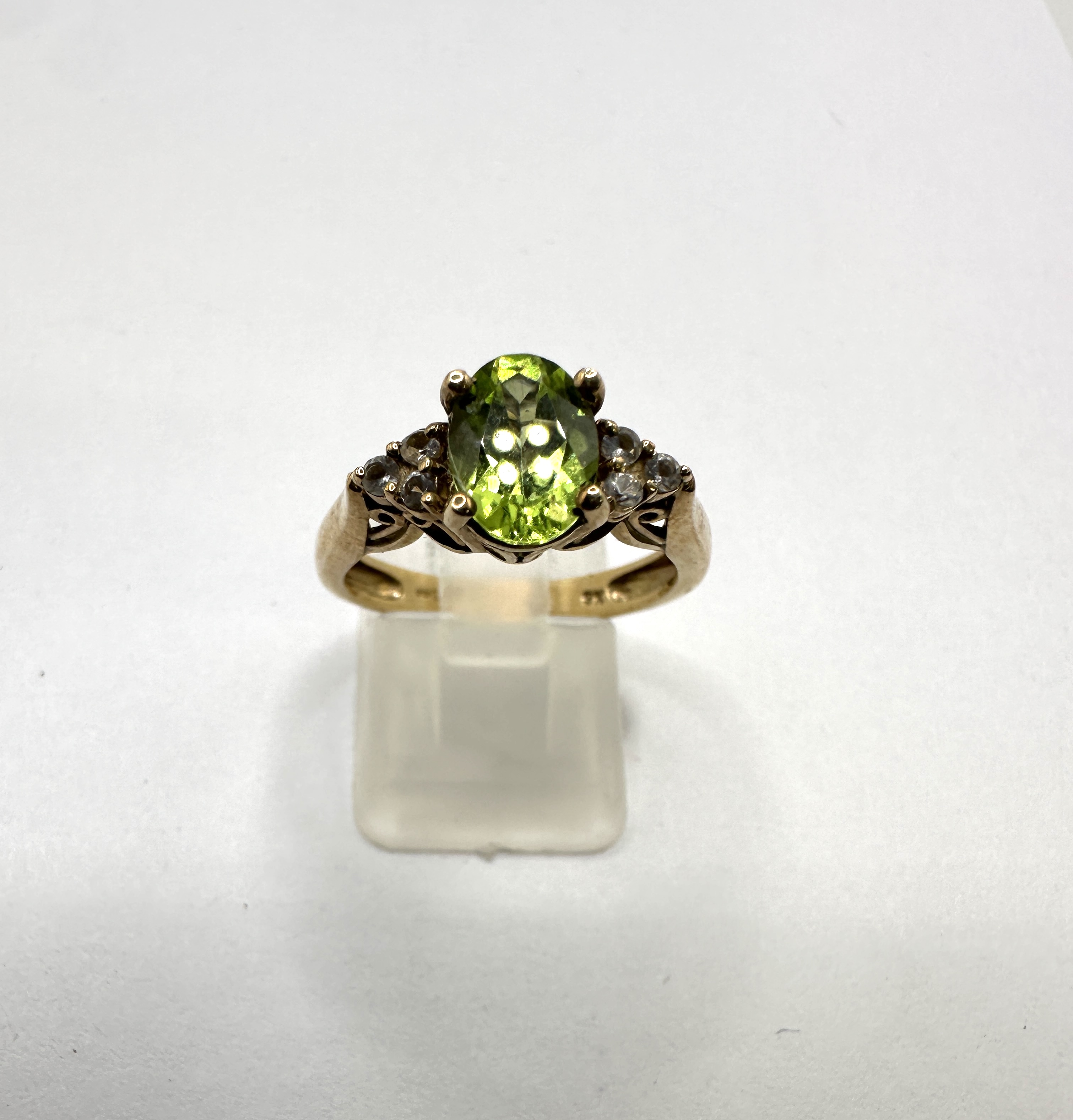 A 9 Carat Yellow Gold Peridot and Colourless Stone Cocktail Ring