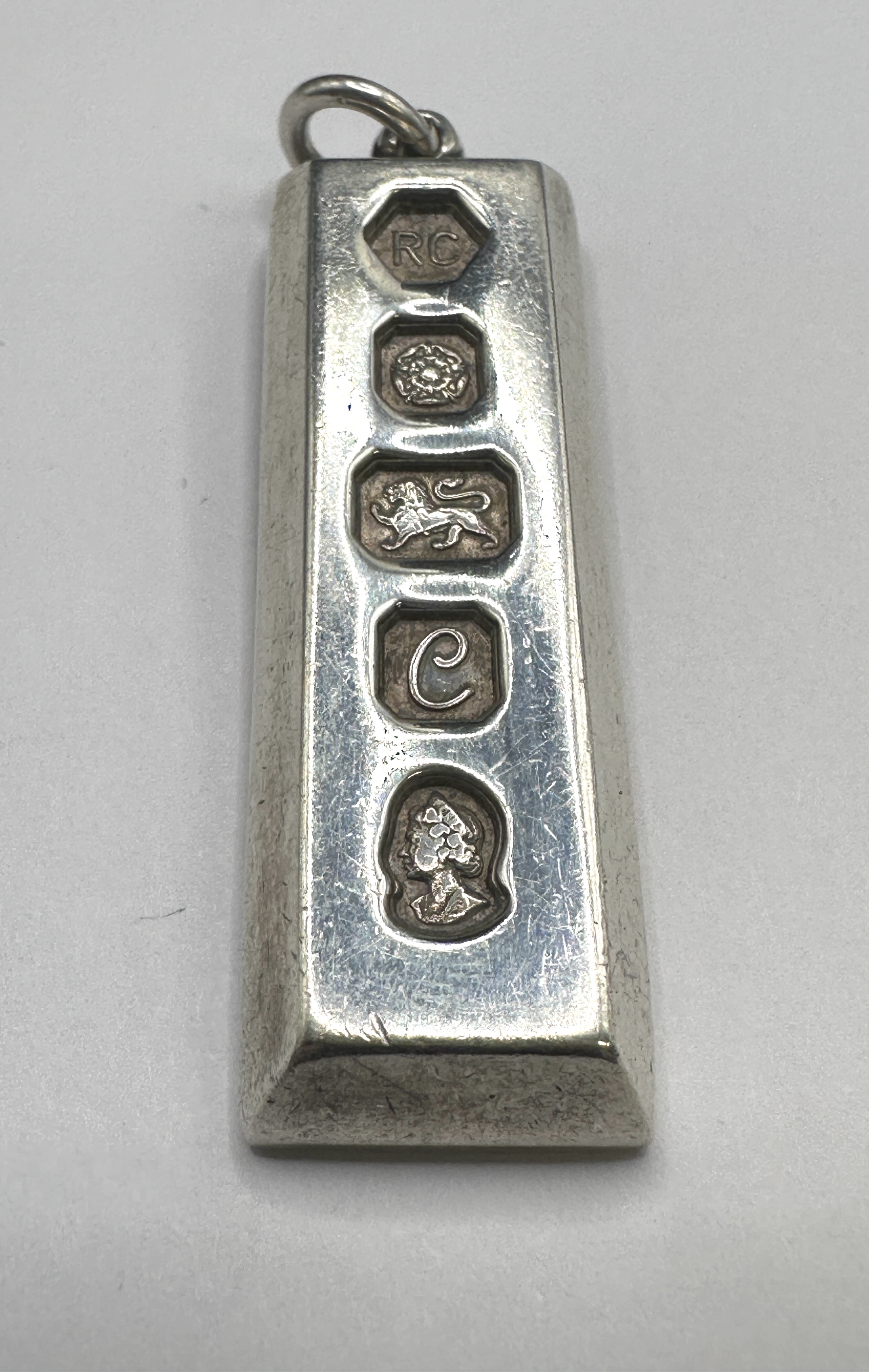 A 1977 Queen Elizabeth II Silver Jubilee Sterling Silver Ingot Pendant by Carrs of Sheffield Ltd