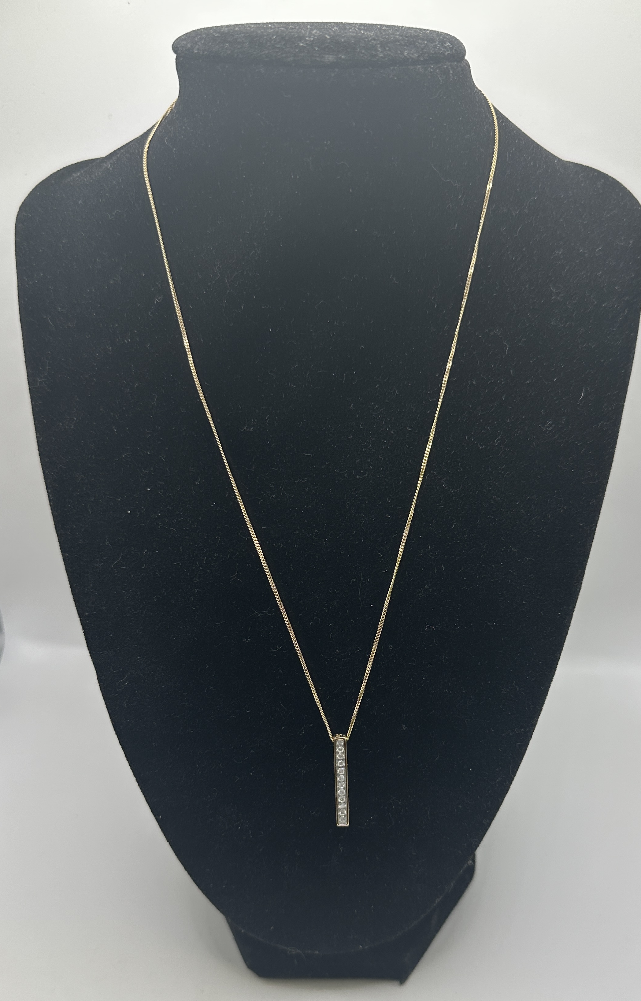 A 9ct yellow gold and diamond-set vertical bar pendant necklace