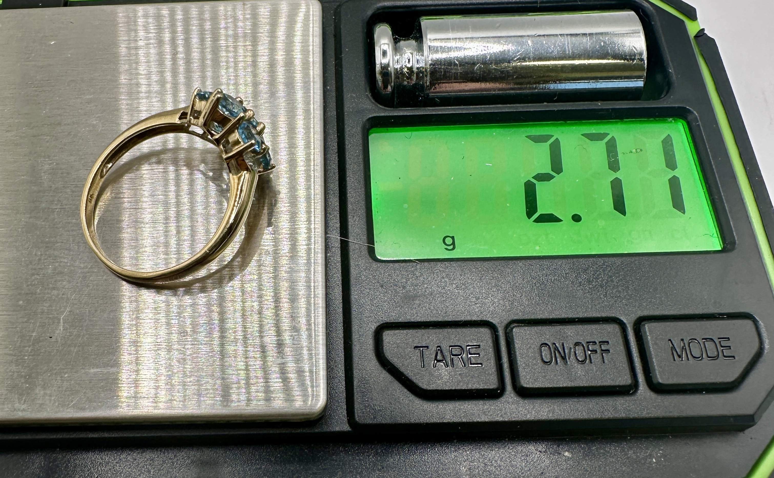 A 9 Carat Yellow Gold Blue Topaz and White Accent Stone Cluster Ring
