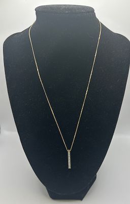 A 9ct Yellow Gold and Diamond Set Vertical Bar Pendant Necklace. A contemporary 9 carat yellow 