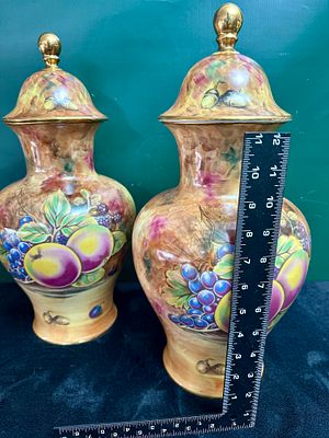 A Pair of Bareuther Porcelain Lidded Urns Hand-Painted by A. Mellor. A pair of porcelain lidded 