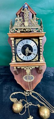 A Dutch Zaanse Style Wall Clock with Franz Hermle Movement. A Dutch Zaanse style weight-driven 