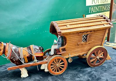 A Decorative Wooden and Ceramic Model of a Horse-Drawn Gypsy Caravan with Music Box. A detailed 