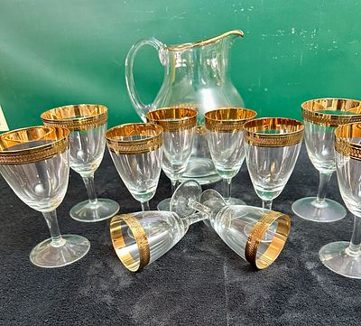 A Vintage Gilded and Acid-Etched Glass Beverage Set Comprising a Pitcher and Ten Matching 