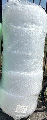 A Large Roll of RAJA Large Bubble Wrap Packaging. A large industrial roll of air-cushioned 