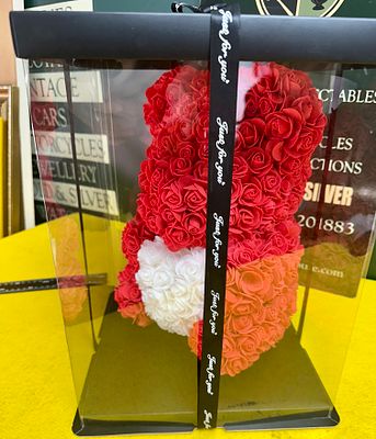A Contemporary Synthetic Rose Teddy Bear in a Presentation Box. A decorative teddy bear figure 