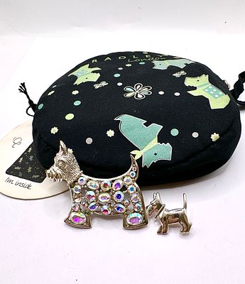 A Pair of Radley London Scottish Terrier Brooches with Branded Fabric Pouch. This lot comprises 