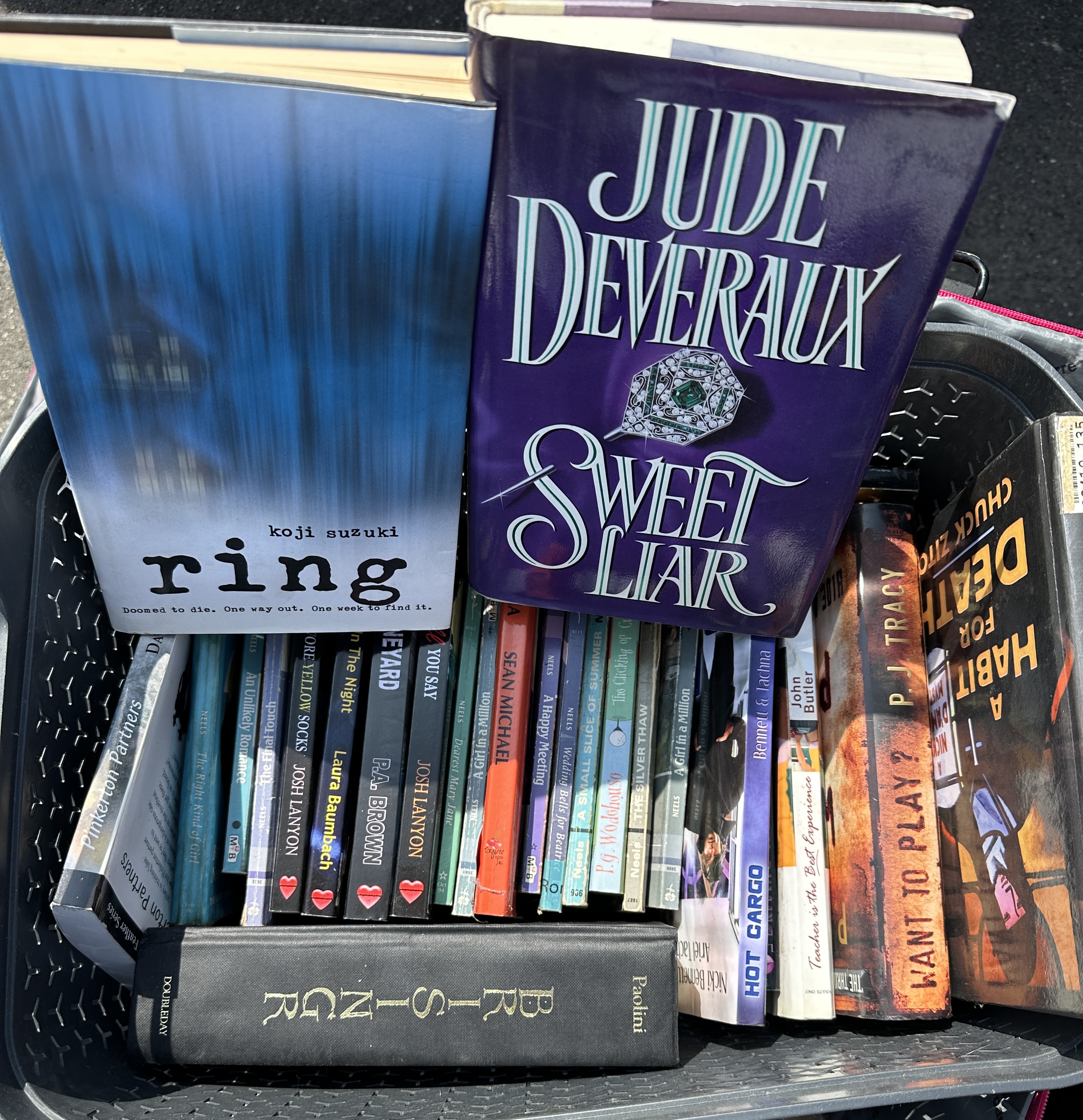 A Collection of Books including Koji Suzuki, Jude Deveraux, and Christopher Paolini. (DJ)