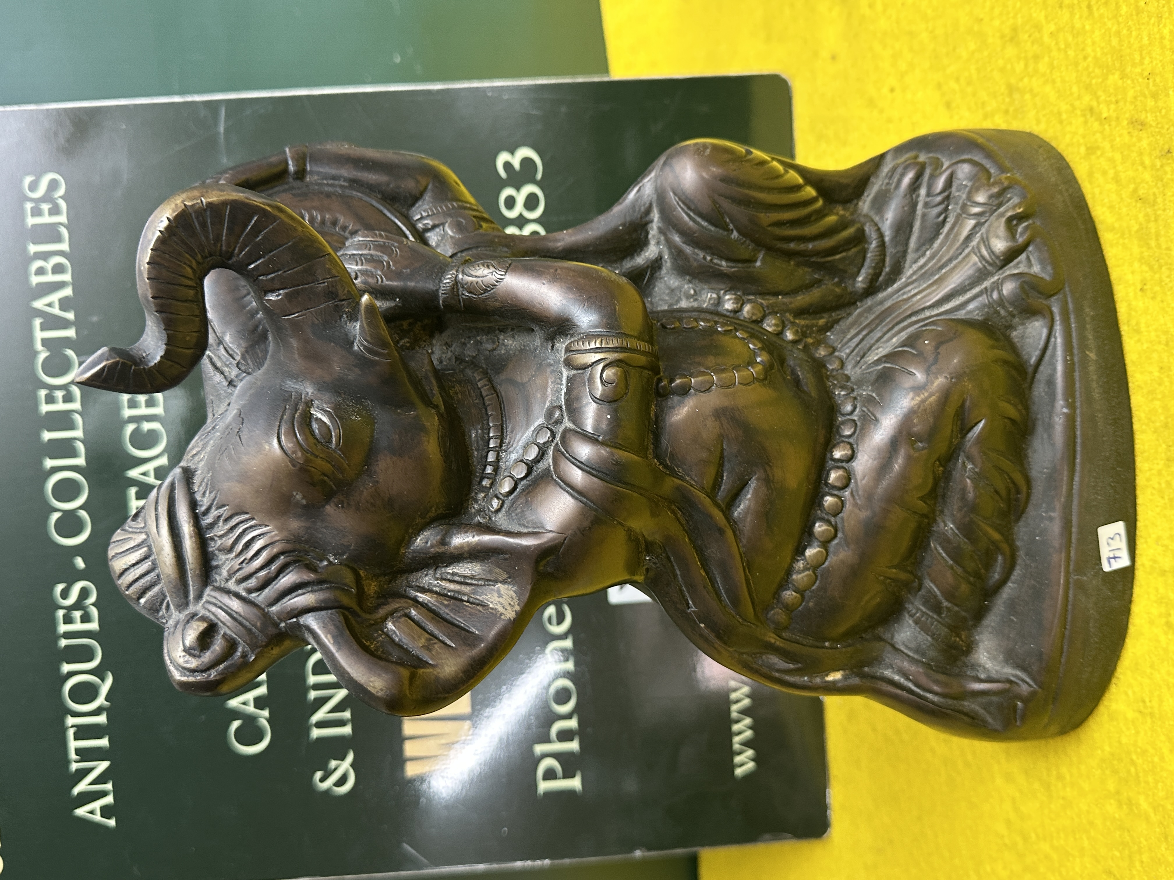 A Reclining Anthropomorphic Nandi Bronze Sculpture