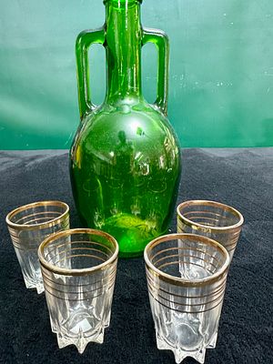 A Set of Mid-20th Century Green Glass Decanter and Gilded Tumblers. This set comprises an 