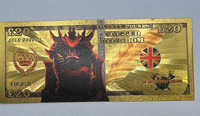 A Warhammer and Warhammer 40,000 Gold-Coloured Foil Novelty Twenty Pound Note. A novelty 