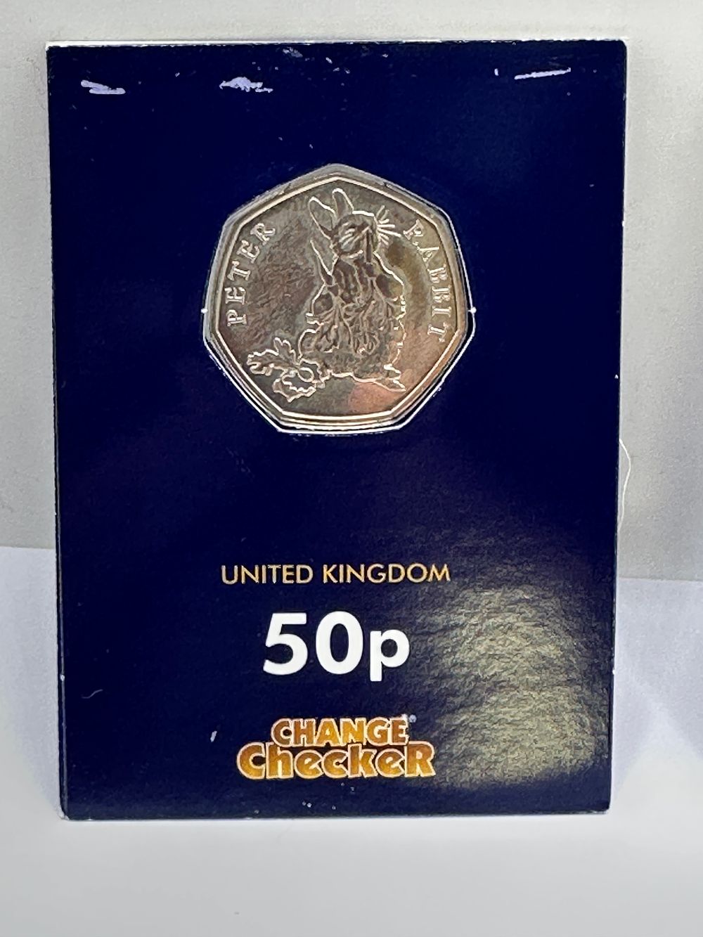 Lot 308: UK 2016 Peter Rabbit Beatrix Potter Commemorative 50p Coin in Change Checker Card