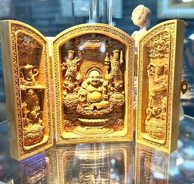 A Chinese Carved Boxwood Triptych Travelling Shrine of Maitreya Buddha. A carved boxwood 