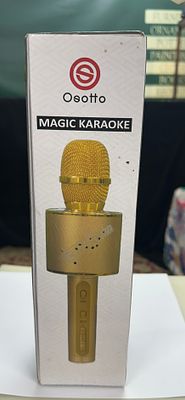 Osotto Magic Karaoke Wireless Handheld Microphone with Integrated Speaker. An Osotto Magic 