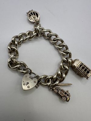 A Vintage 925 Silver Heavy Curb Link Charm Bracelet. A vintage charm bracelet of heavy curb link 