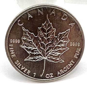 Royal Canadian Mint 1 oz t .9999 Fine Silver Maple Leaf Coin. A Canadian 1 oz Silver Maple Leaf 