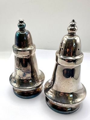 A Pair of Silver-Toned Metal Baluster-Form Condiment Shakers. A pair of condiment shakers of 