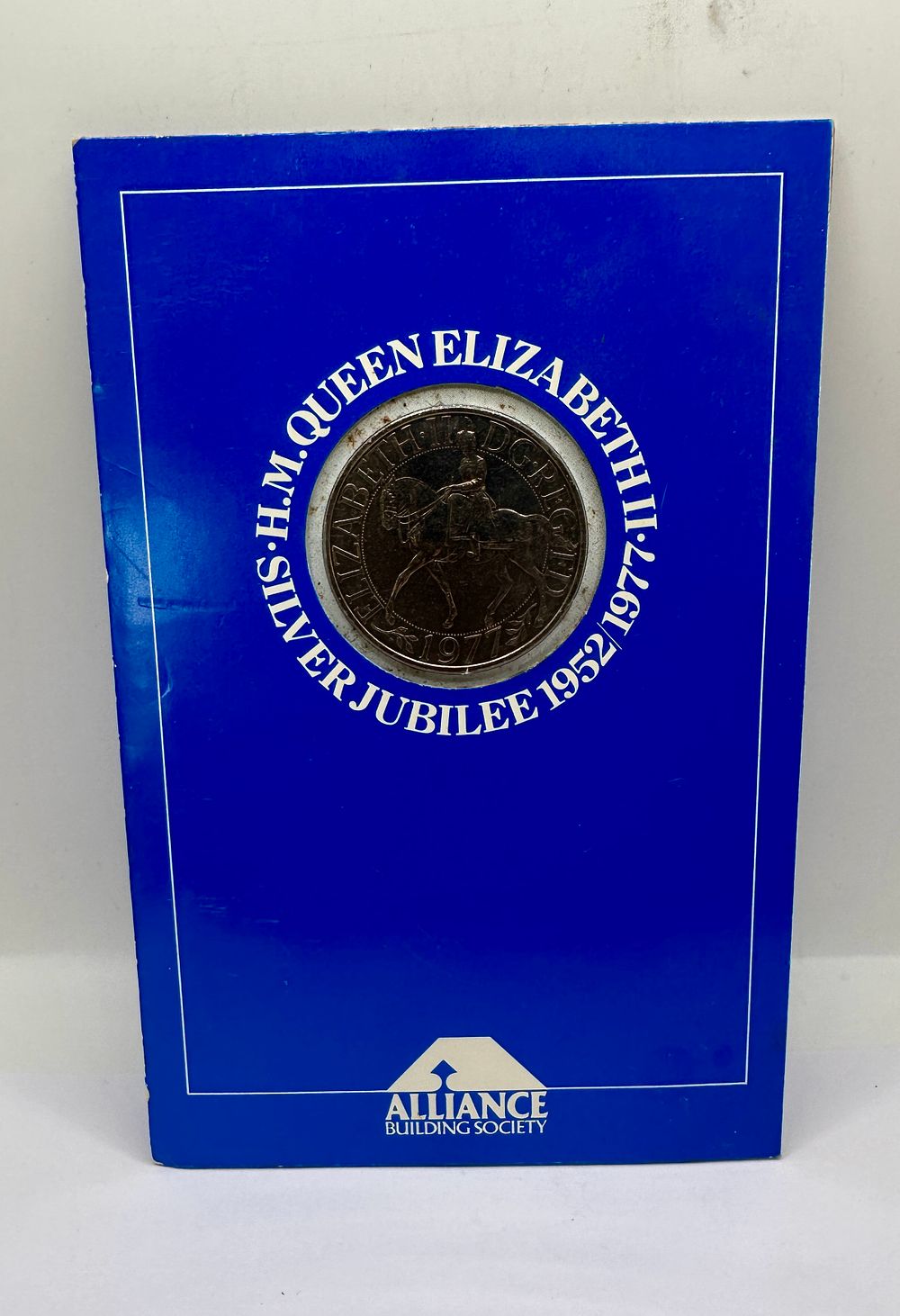 Lot 274: UK 1977 Silver Jubilee Cupro-Nickel Crown in Alliance Building Society Folder