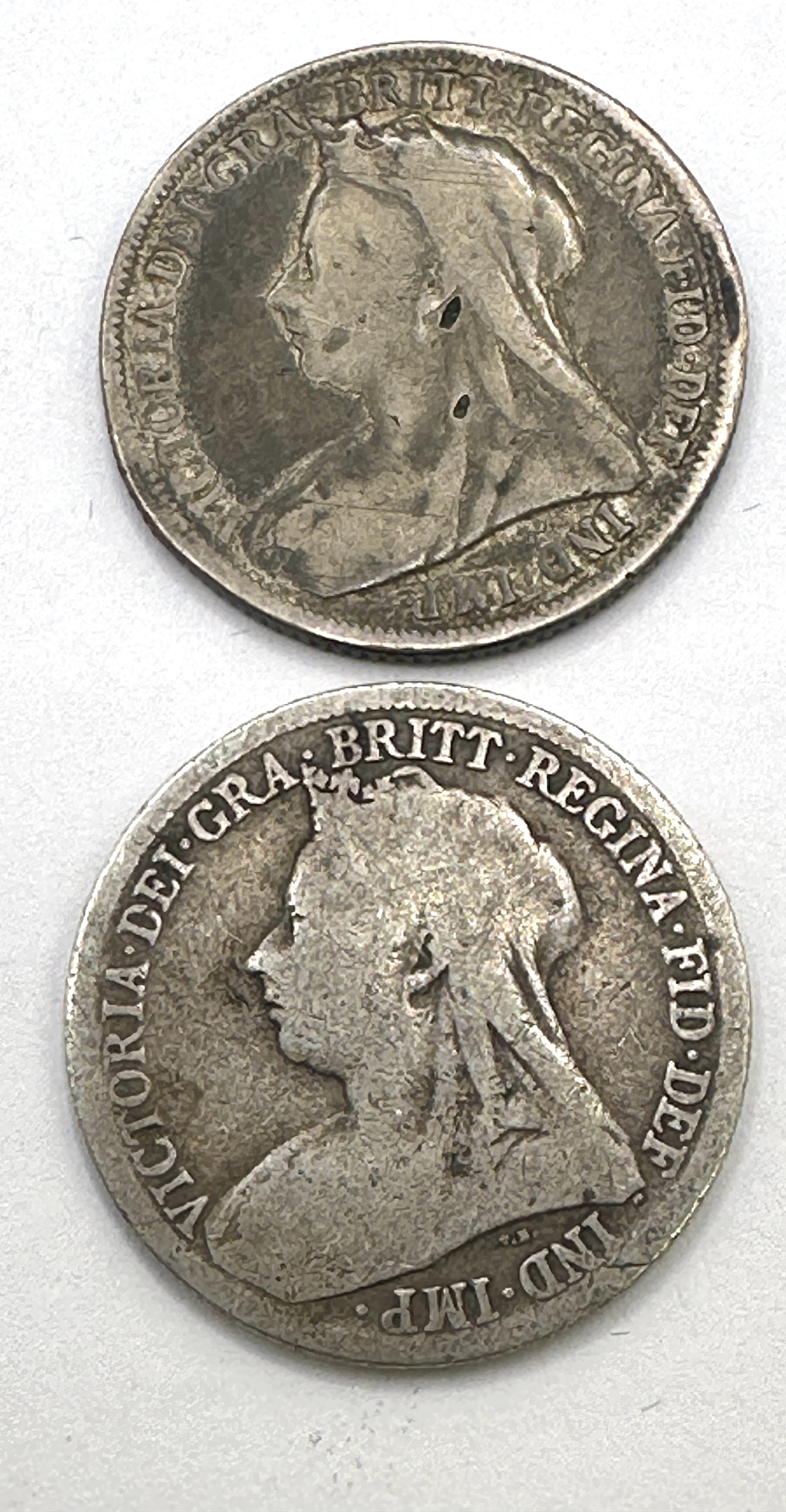 A Pair of UK Queen Victoria Sterling Silver One Shillings, 1898 and 1899