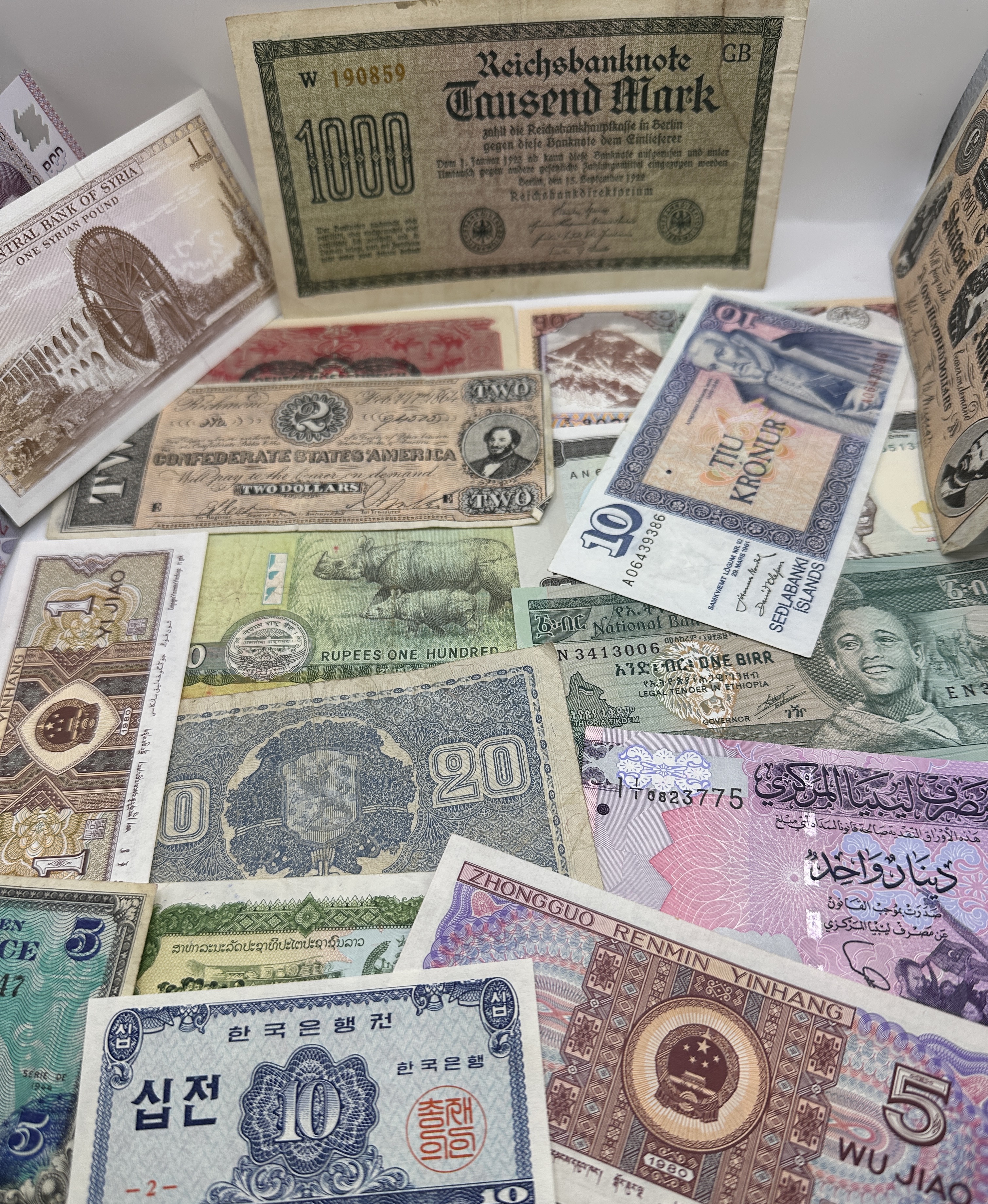 A Collection of International Banknotes including US Confederate and DE Weimar Republic Issues