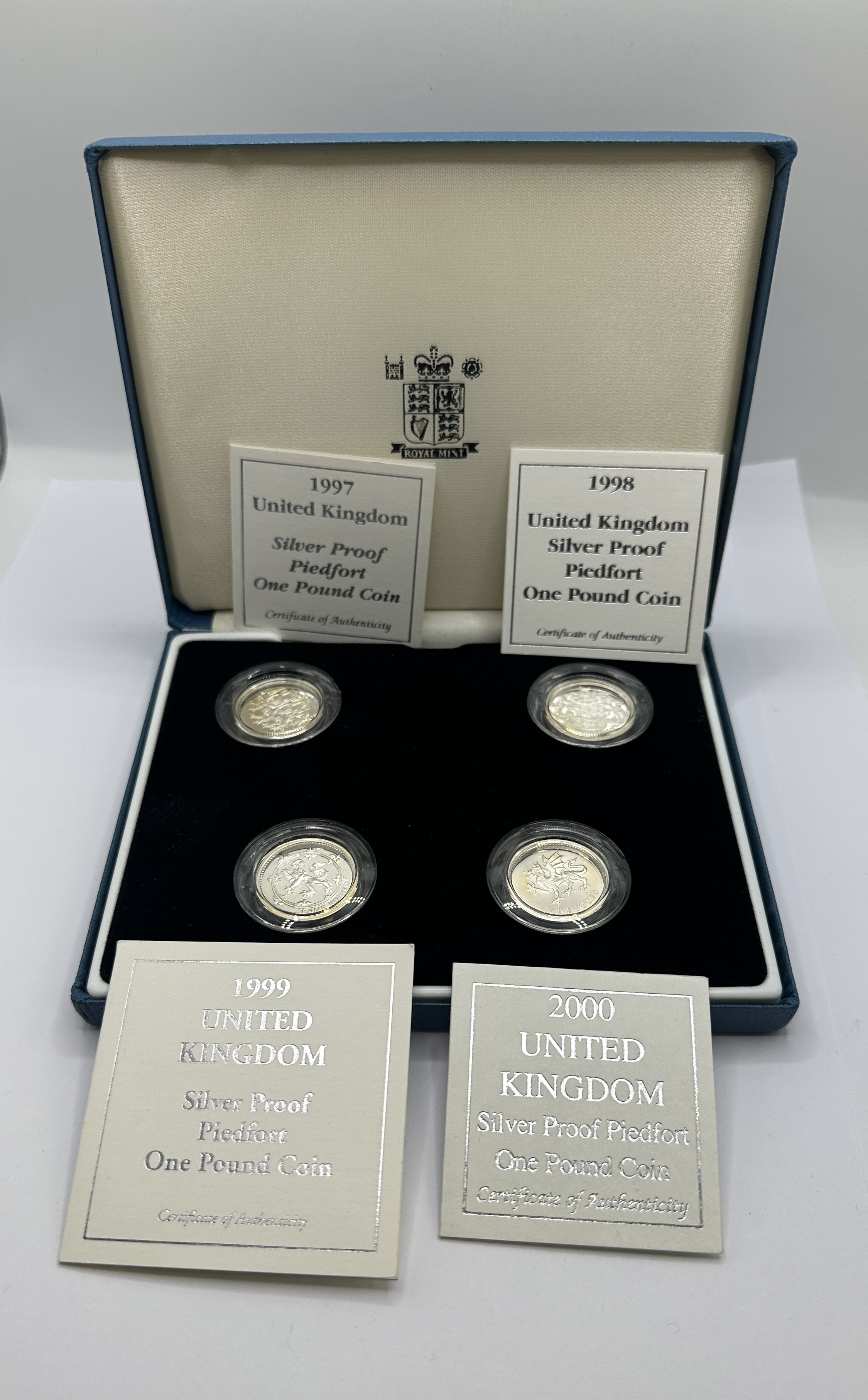 A Four-Coin Set of UK Royal Mint Silver Proof Piedfort One Pound Coins 1997-2000
