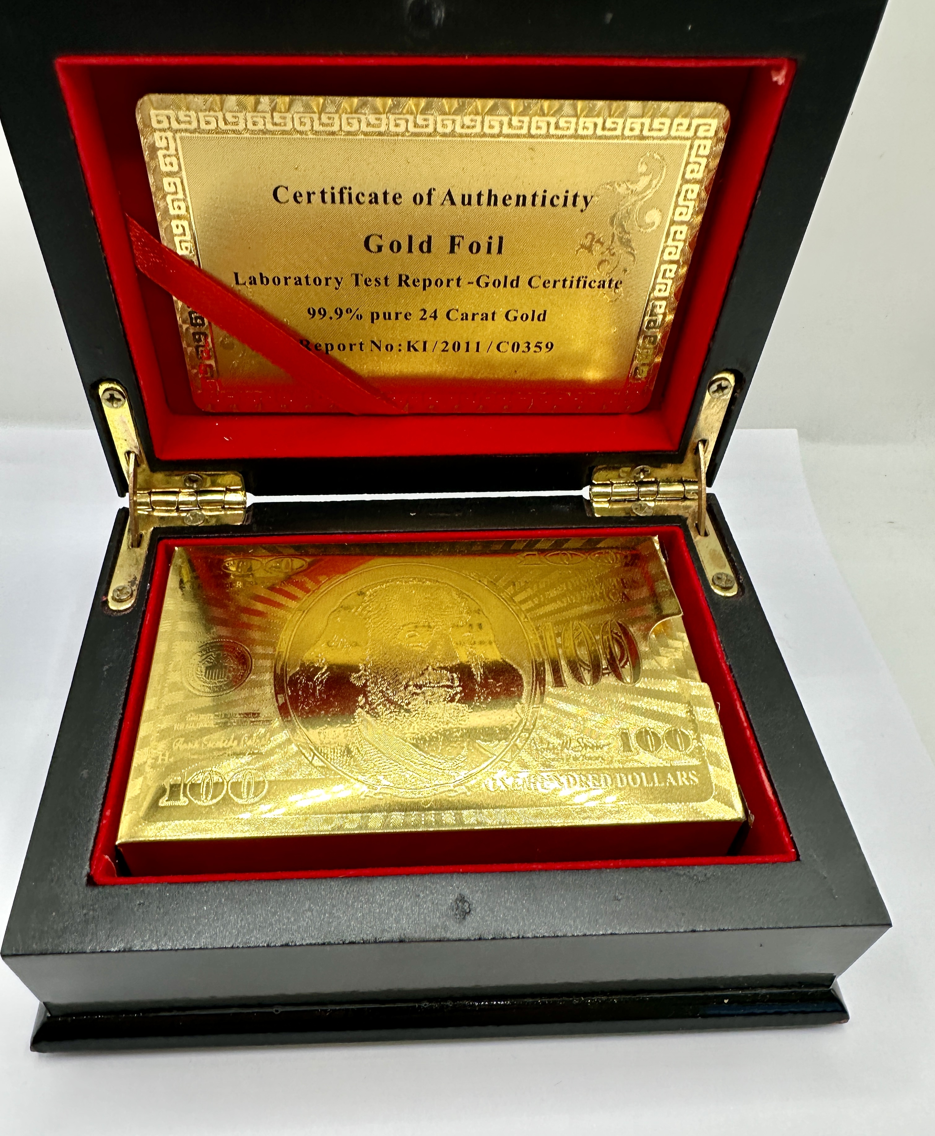 A Set of 24 Carat Gold Foil Playing Cards in a Lacquered Wooden Presentation Box