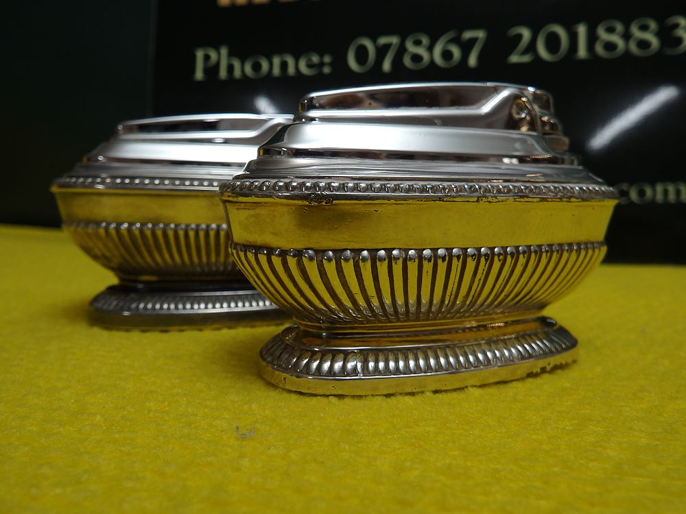 Lot 236: A Pair of Ronson Silver-Plated Queen Anne Style Table Lighters