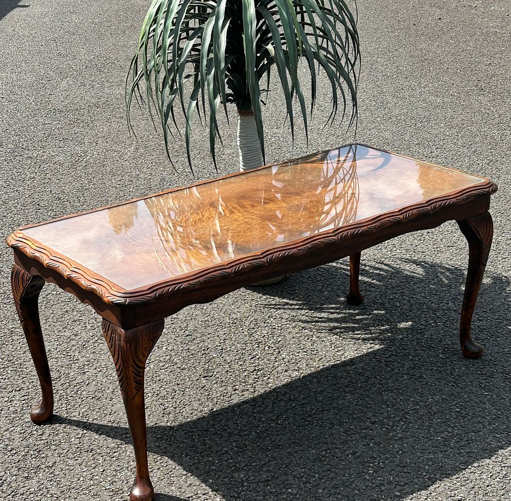 Lot 256: A Queen Anne style burr walnut coffee table with protective glass top