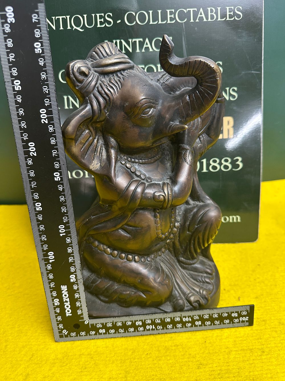 Lot 258: A Cast iron Sculpture of Relaxing Ganesha