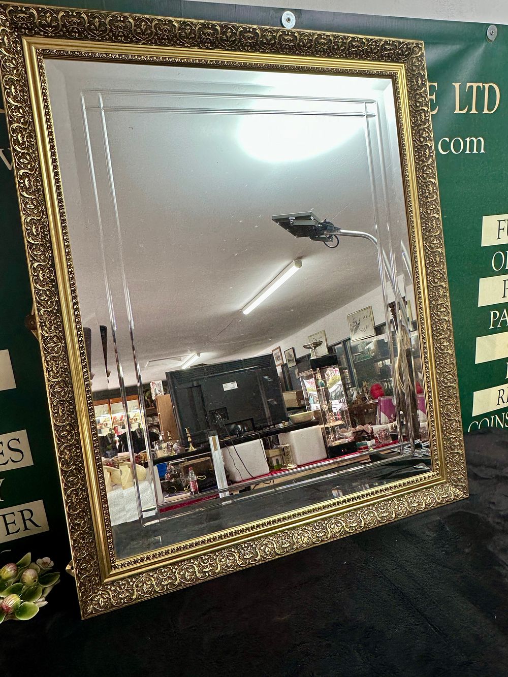 Lot 272: A large ornate gilt framed wall mirror with double-stepped bevelled plate