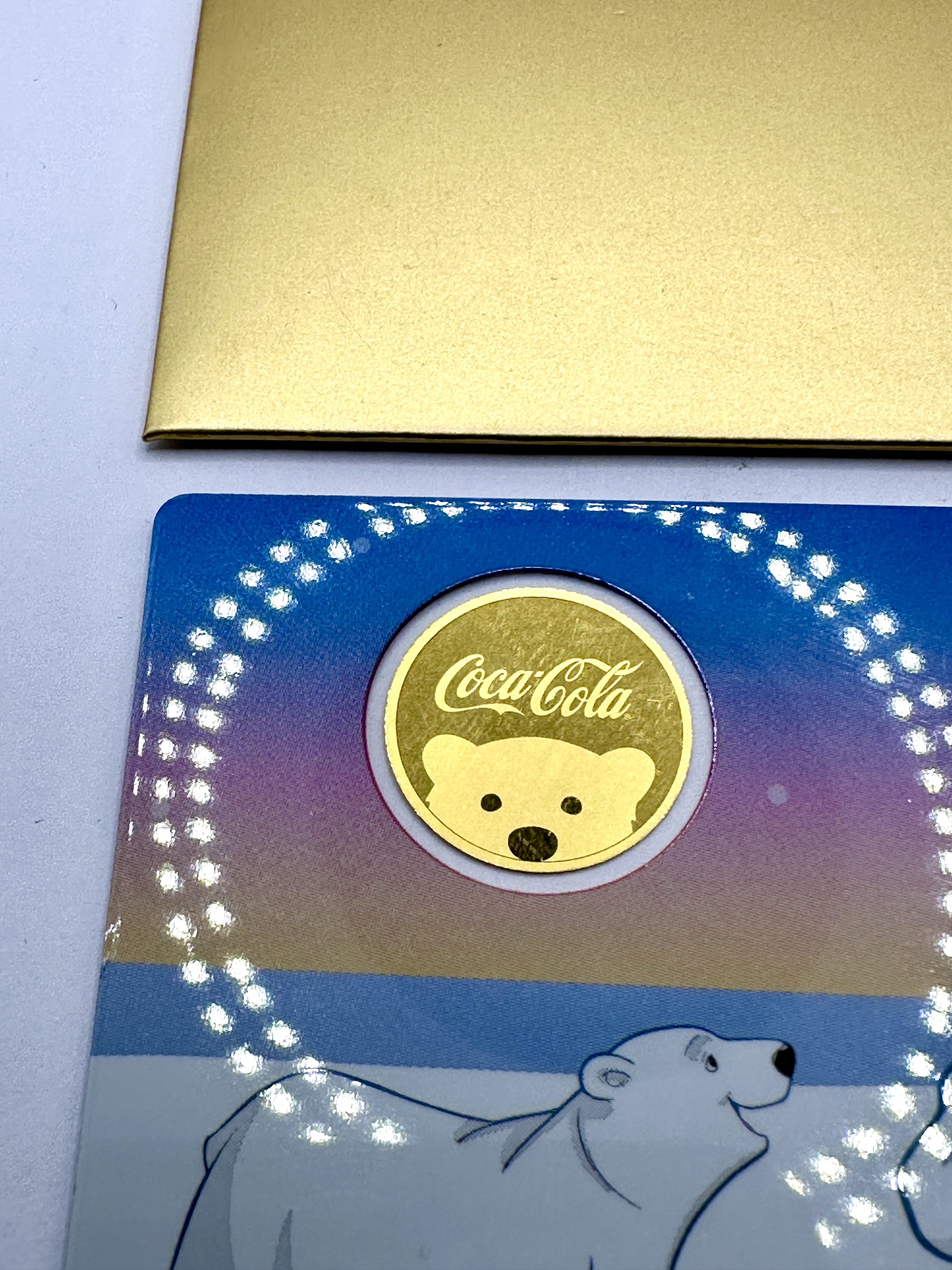 A Coca-Cola Polar Bear Commemorative Round and Coincard