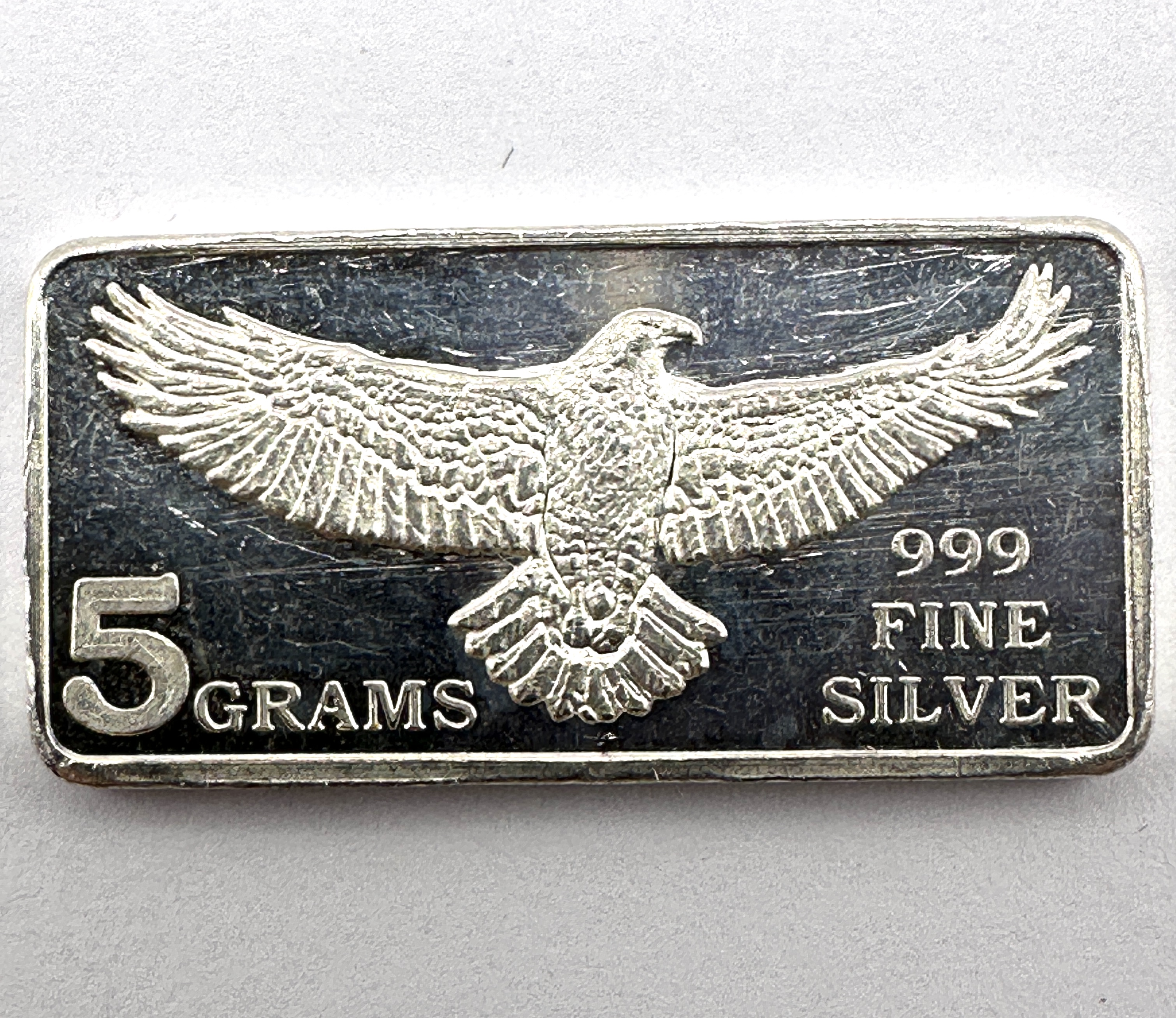 A Monarch Precious Metals .999 Fine Silver 5 Gram Eagle Bar