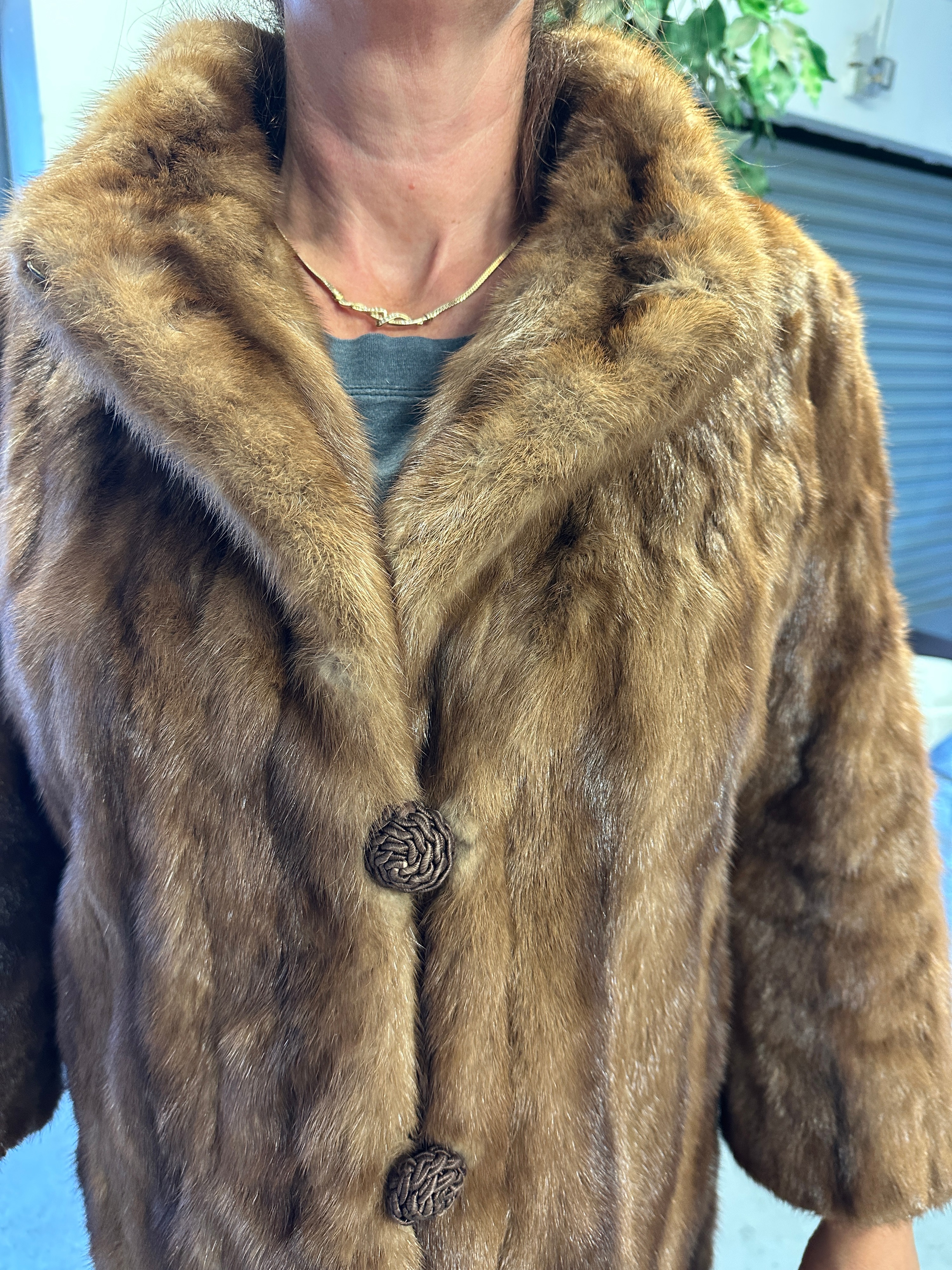 A Fur Coat with Shawl Collar and Martingale Detail