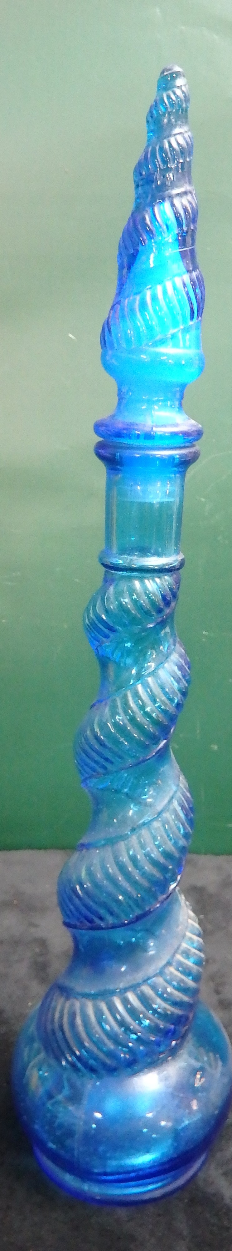 A Blue Glass Bottle and Stopper, with spiral ribbed decoration