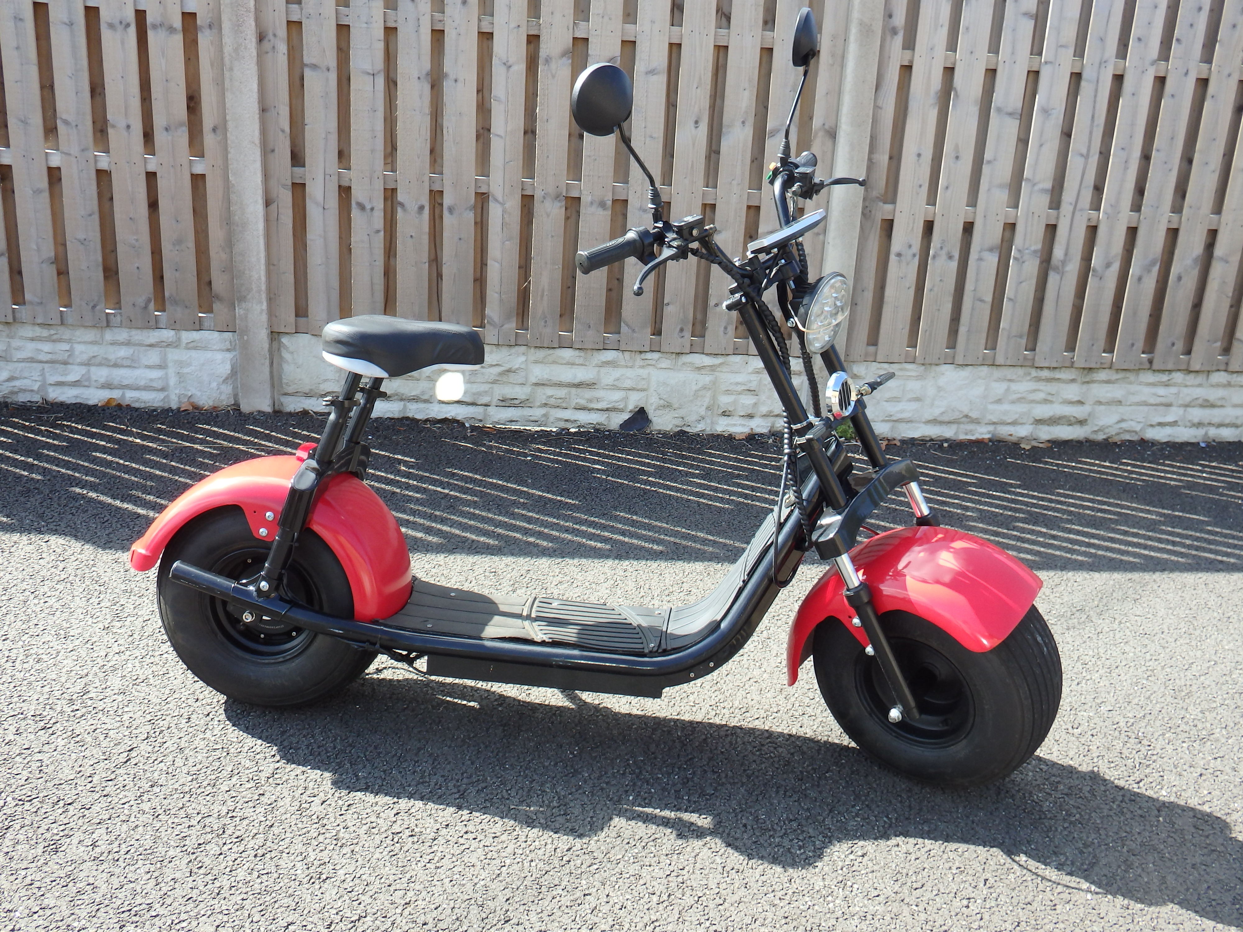 A Contemporary Fat-Tyre Electric Scooter with Red Fenders