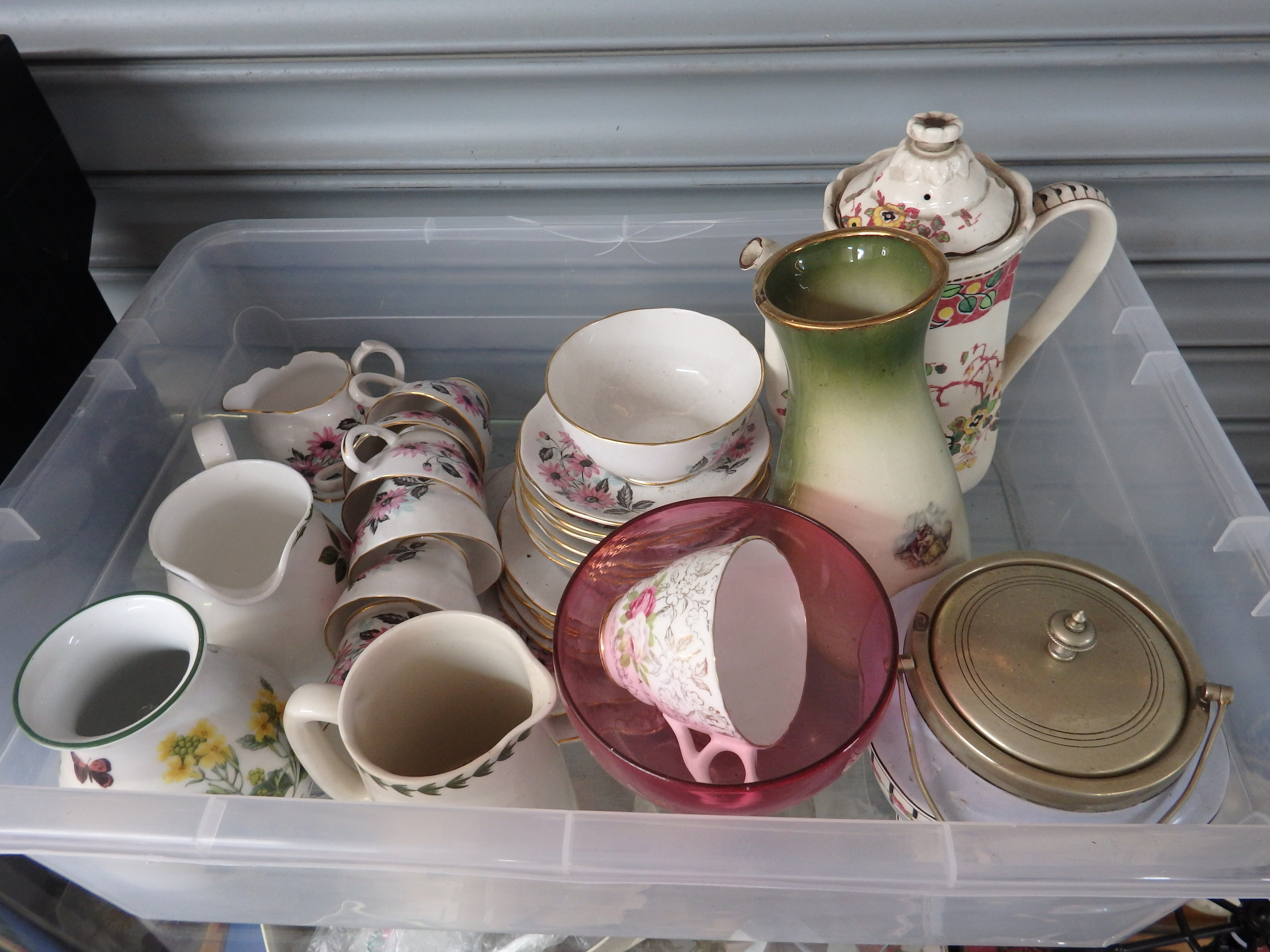 An Assortment of Decorative Ceramic Tablewares and a Red Glass Bowl