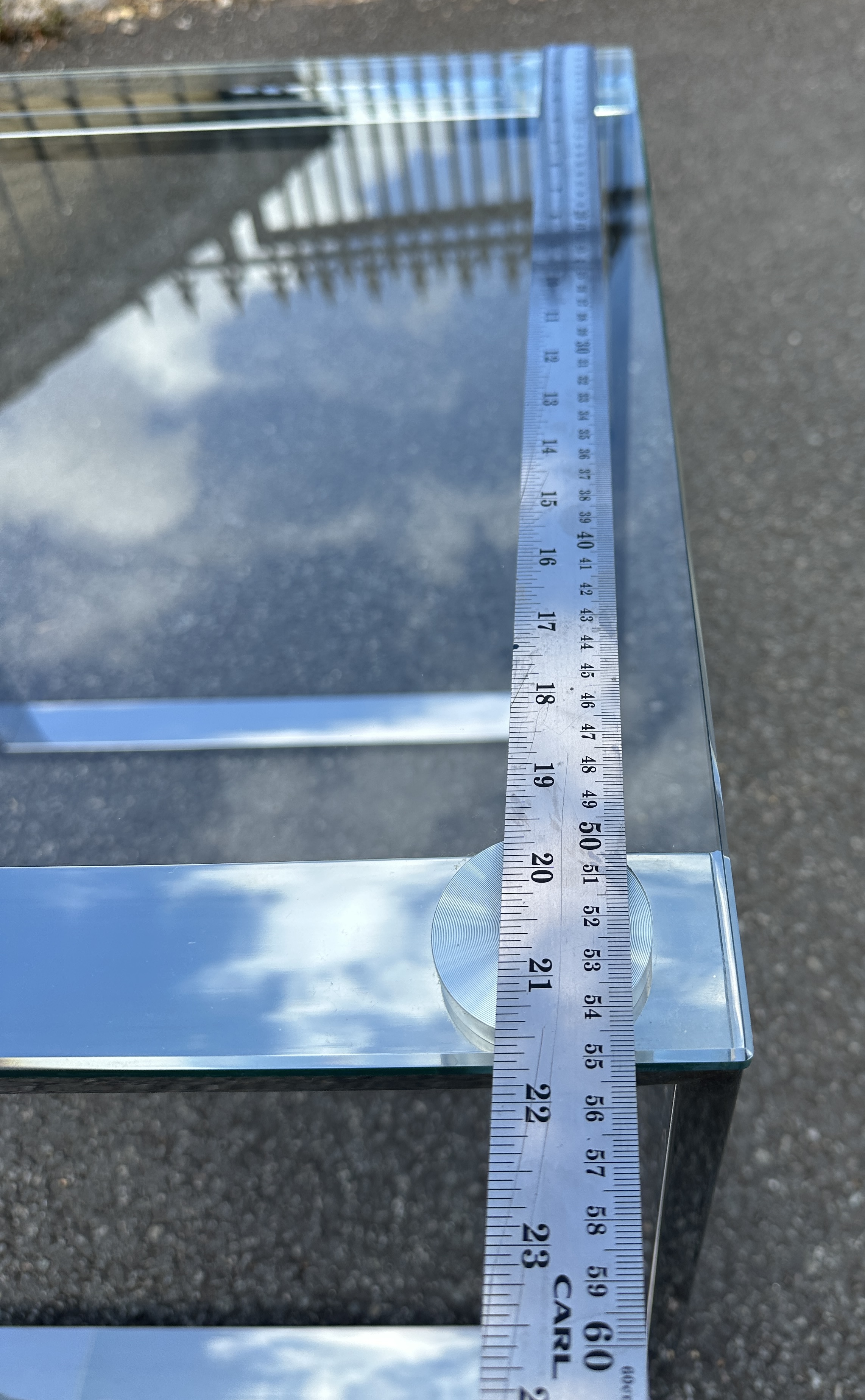 A Contemporary Rectangular Tempered Glass and Polished Chrome-Plated Metal Coffee Table