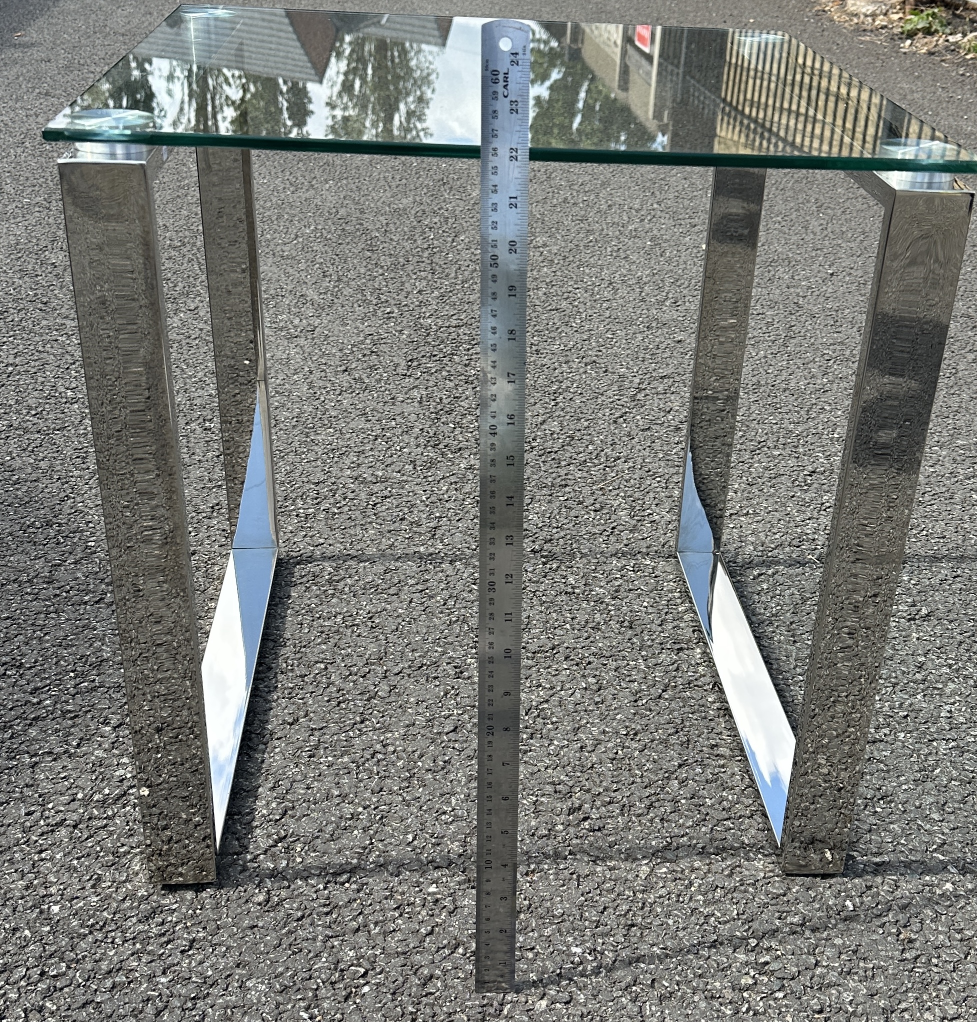 A Contemporary Tempered Glass Side Table with U-shaped Supports
