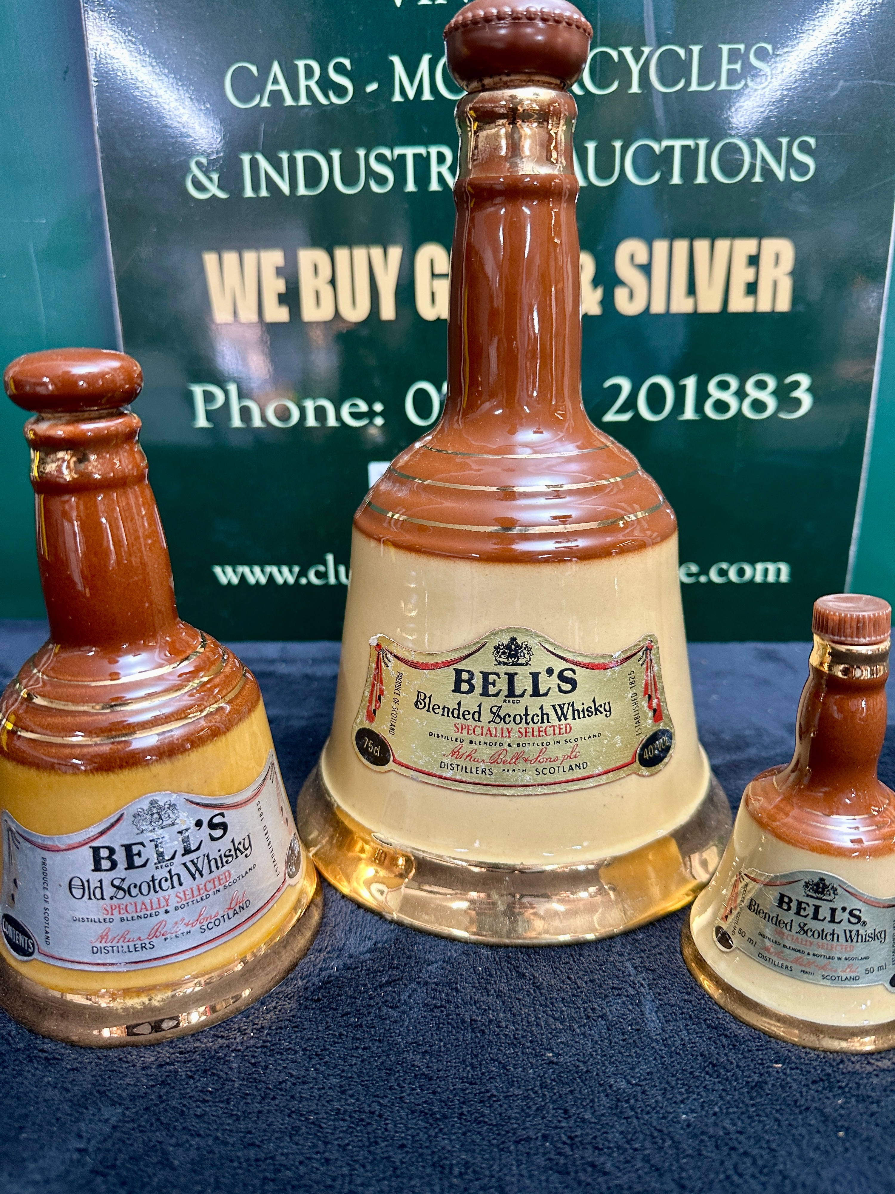 A Trio of Scottish Wade Ceramic Bell's Whisky Decanters
