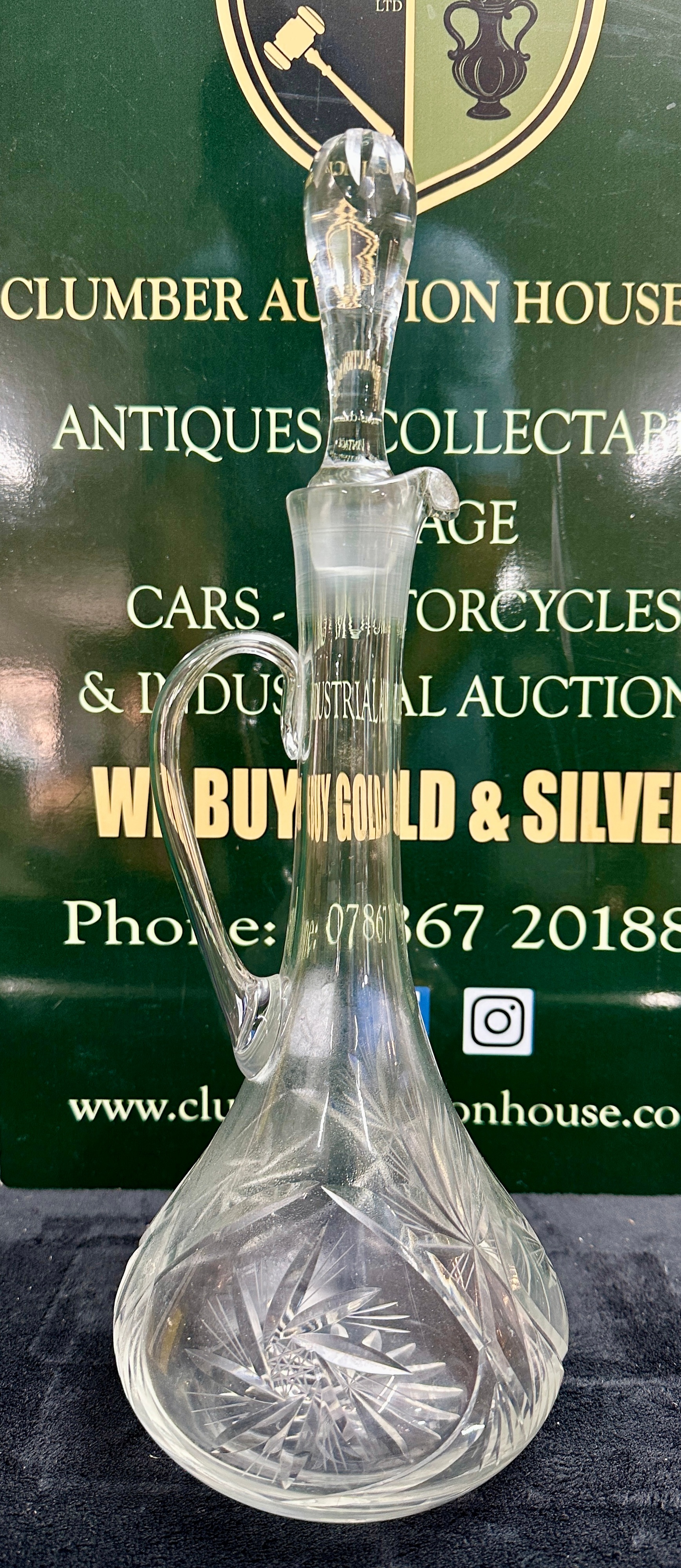 A Glass Claret Jug and Matching Stopper with Starburst Decoration