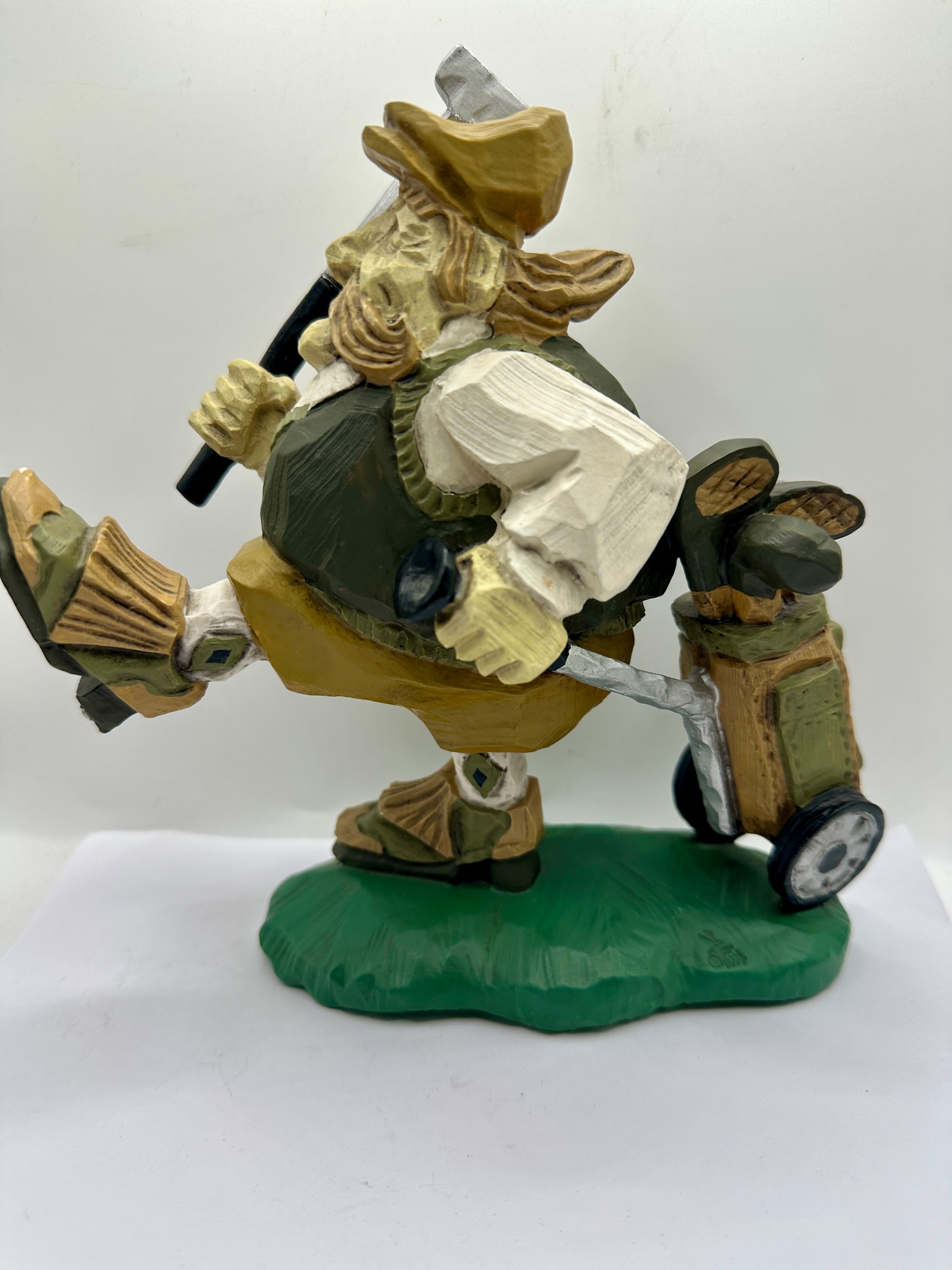 A Contemporary 1996 Painted Figurine of a Golfer with Bag