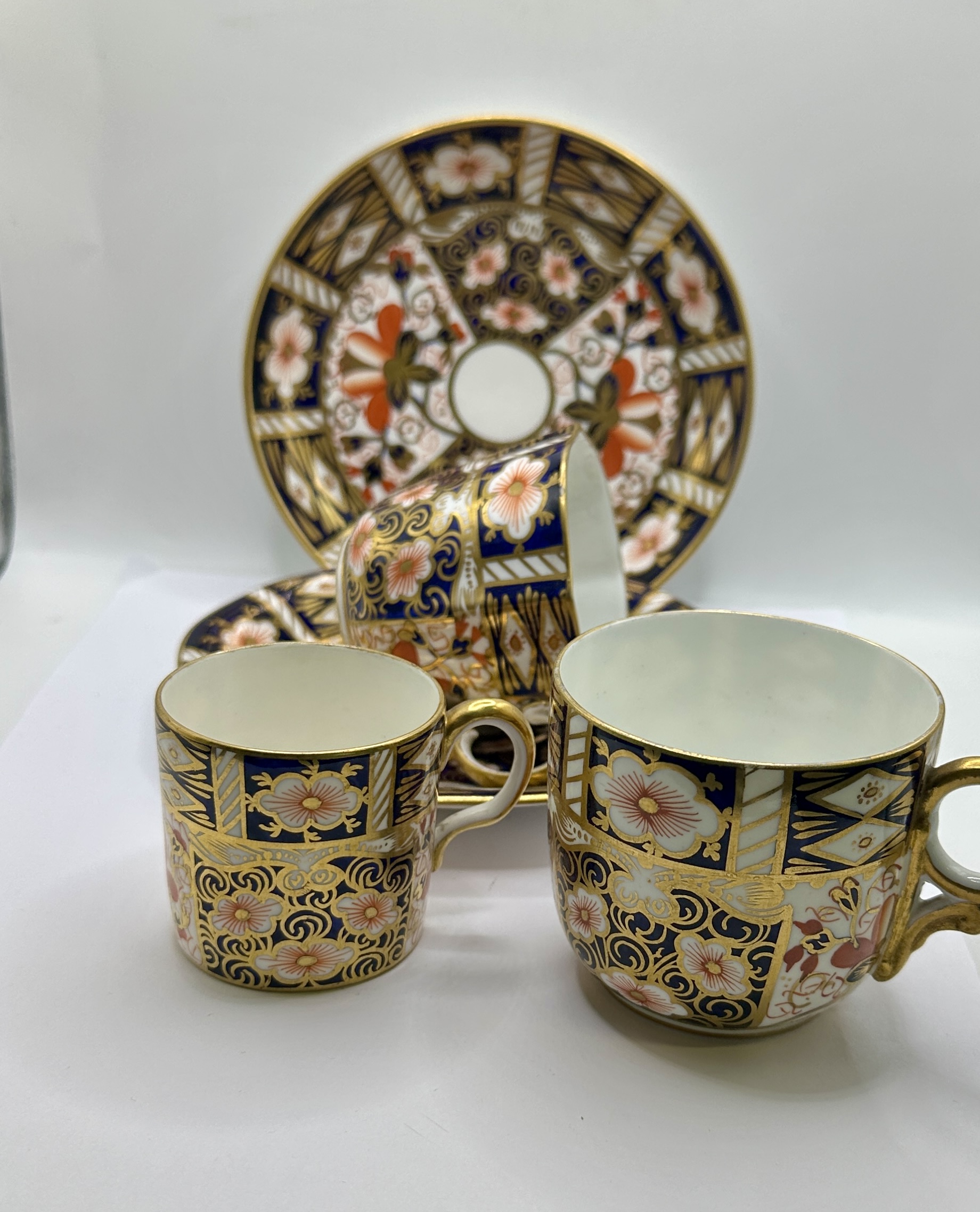 A Royal Crown Derby white metal Set of Three Cups and Saucers